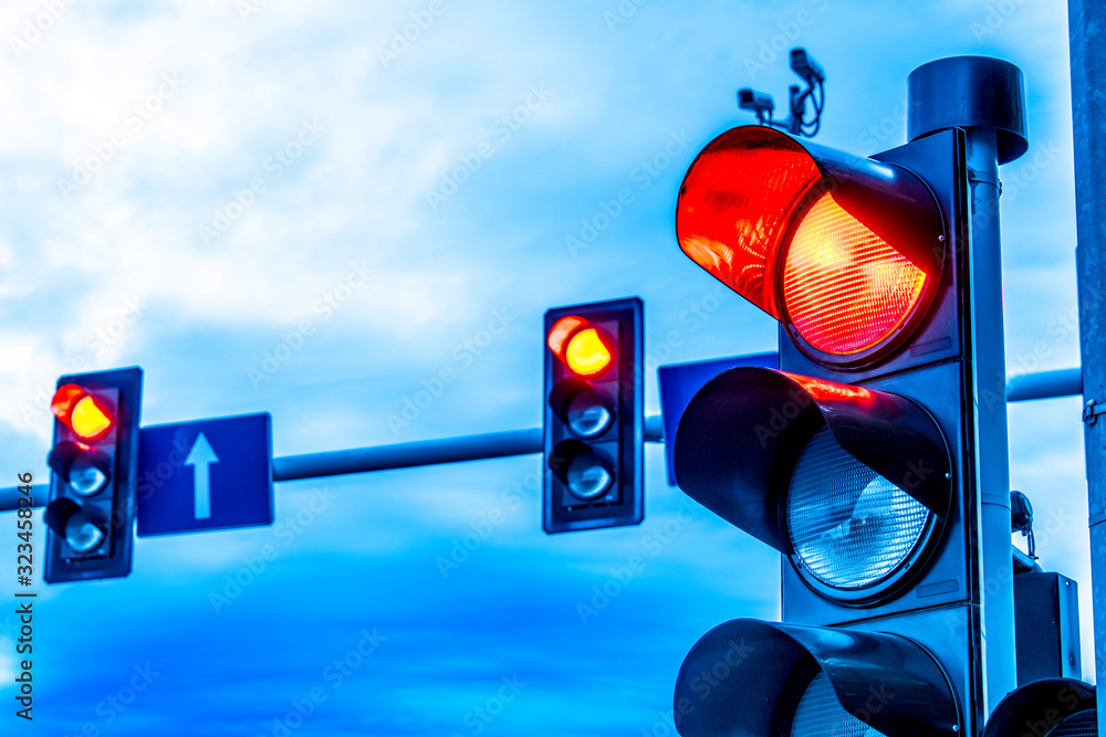 Traffic lights over urban intersection Stock Photo | Adobe Stock