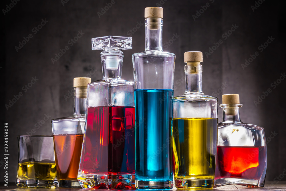 Carafe and bottles of assorted alcoholic beverages. Carafe and bottles of assorted alcoholic beverages.
