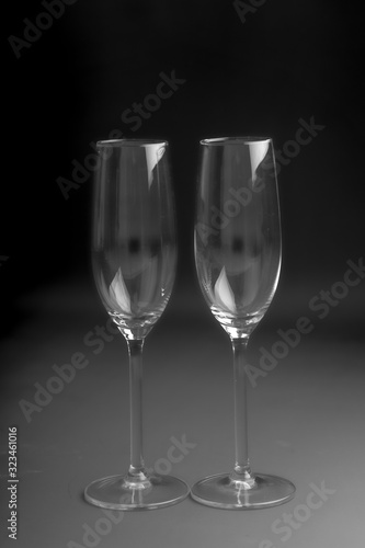 2 champagne or prosecco glasses with black background