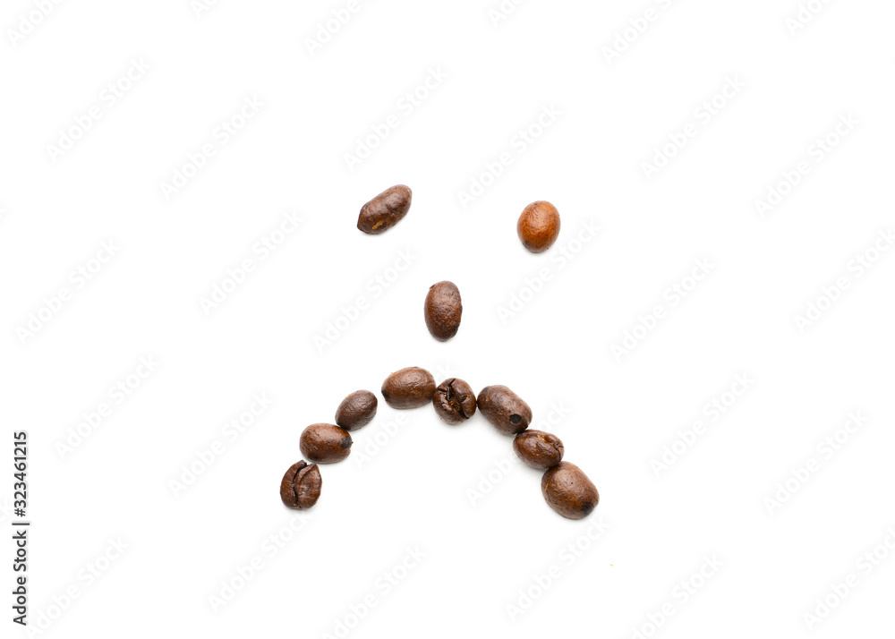 Coffee beans in shape of sad face Coffee beans in shape of sad face