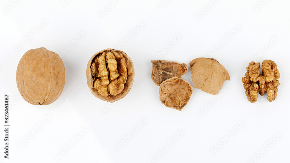 some cracked walnuts isolated on white background