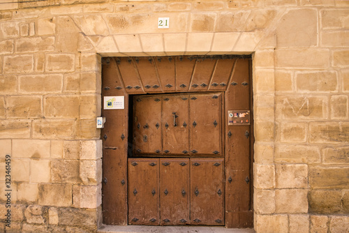 wooden door over stone wall