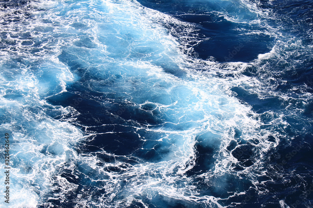 Ocean waves wallpaper, Dark blue water and sea foam from aerial view, Natural abstract pattern background with copy space for web banner and design template.