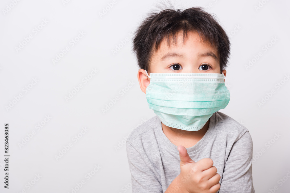 Closeup Asian face, Little children boy sick he using medicine healthcare mask Closeup Asian face, Little children boy sick he using medicine healthcare mask