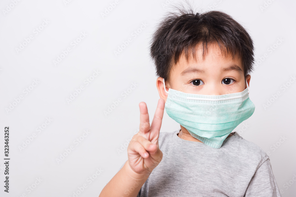 Closeup Asian face, Little children boy sick he using medicine healthcare mask Closeup Asian face, Little children boy sick he using medicine healthcare mask