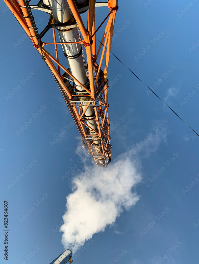 Fotografie View on industrial chimney from bottom