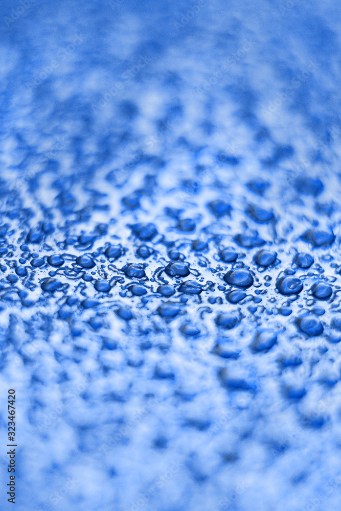 Drops on the skin. Artificial leather. Close-up of water drops. Abstract blue wet texture with drops on the surface. Realistic clean water drops. Classic blue Drops on the skin. Artificial leather. Close-up of water drops. Abstract blue wet texture with drops on the surface. Realistic clean water drops. Classic blue
