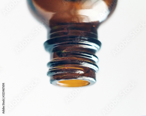 Cosmetic and medical bottle close-up isolated on a white background. Essential oil, hyaluronic acid. Omega-3. Herbal essence. Alternative healthy medicine. Skin care.