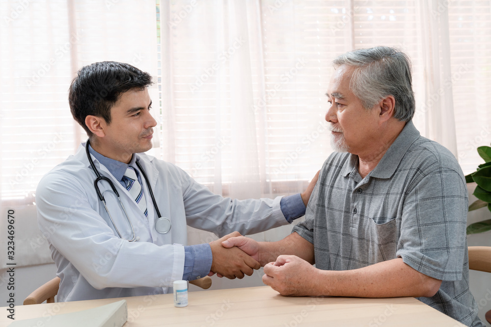 Doctor shaking hands with elderly patient after explain to use medicine on the table. Doctor shaking hands with elderly patient after explain to use medicine on the table.