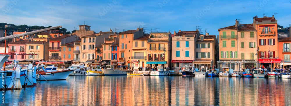 Beautiful capture of the famous little village and harbour of Cassis in the south of France on a winter evening. Super colourful houses and boats in a picturesque town.