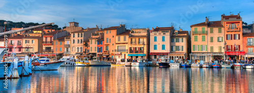 Beautiful capture of the famous little village and harbour of Cassis in the south of France on a winter evening. Super colourful houses and boats in a picturesque town.