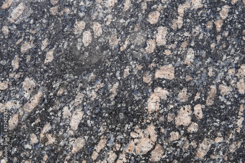 Natural stone red granite texture background. Bright hard red granite texture. Red granite texture stone background. Red granite texture untreated surface. Facing material horizontal background. photo