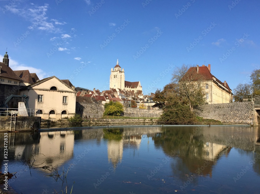 The Notre-Dame de Dole church and the old town seen from the Rhône-Rhine Canal's banks, France