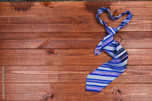 accessories for men. colorful ties on a wooden background. concept of happy father's day or shoppig photo