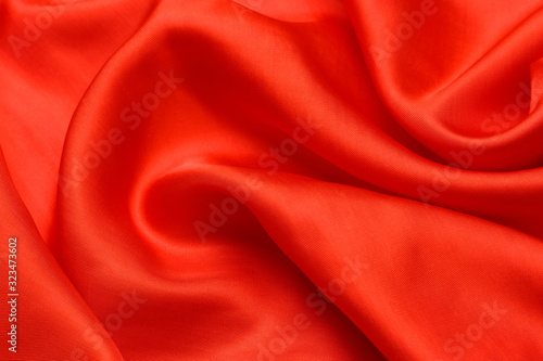 expensive fabric texture. abstract background with soft waves. Smooth elegant red silk or satin luxury cloth