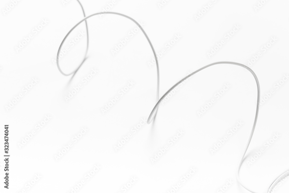 Obraz premium white new wire cable isolated on a white background abstraction.