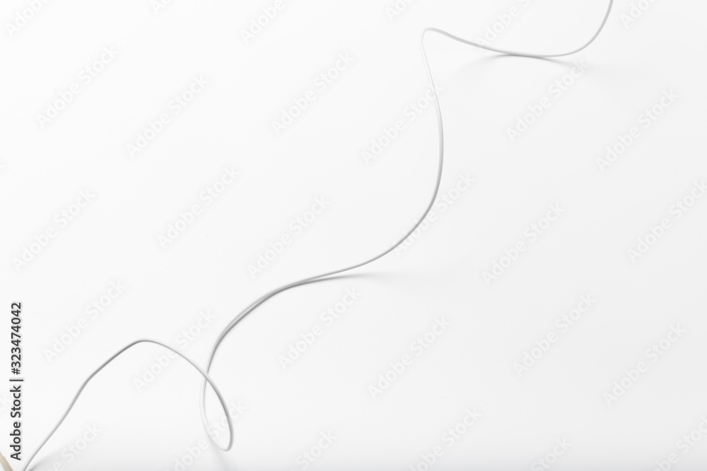Fototapeta premium white new wire cable isolated on a white background abstraction.
