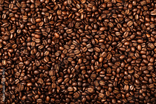 Coffee beans texture. Roasted coffee beans as background. Flat lay, top view, copy space