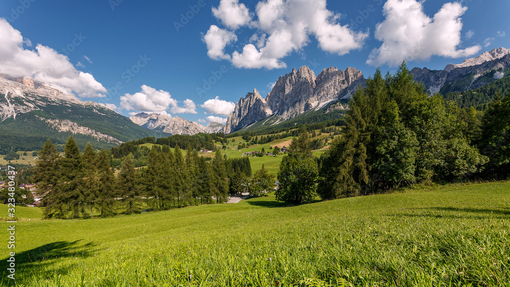 Mountain green valley landscape. Impressive landscape with a Majestic rocky Mountains Green Trees and Fresh Grass in the Dolomites mountains. Wonderful Nature Scenery. Beautiful of World.