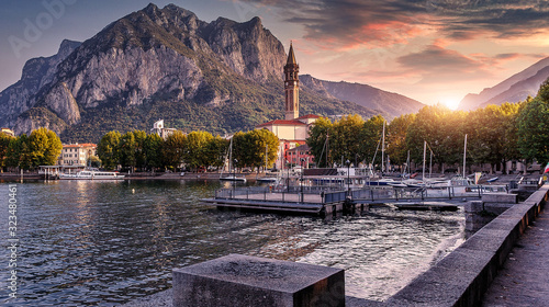 Wonderful picturesque Scene Colorful Sunset over the Lecco town on Como lake. Italy. Wonderful Autumn cityscape. Picturesque view of nature.   Best popular places for travel. Beauty of World.