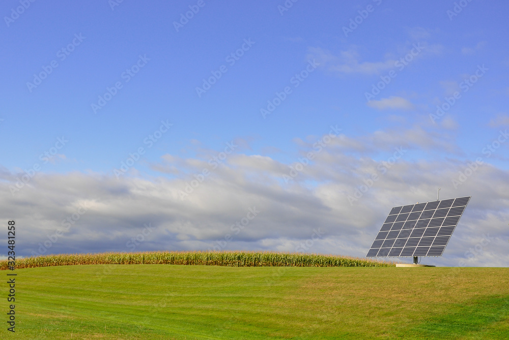 Solar panel standing in a green field 