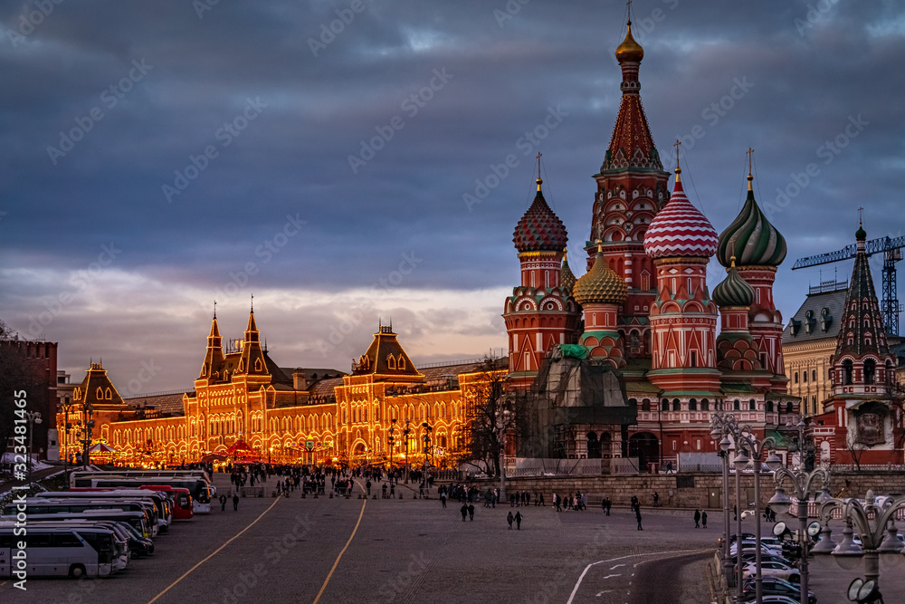 Wide angle view of the city of Moscow with Moscow Kremlin, TSUM and The Cathedral of Vasily the Blessed in winter at sunset. Travel destination Moscow, Russia