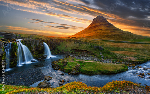 Incredible Nature landscape of Iceland. Fantastic picturesque sunset over Majestic Kirkjufell (Church mountain) and waterfalls. Kirkjufell mountain, Iceland. Famous travel locations. Creative image.