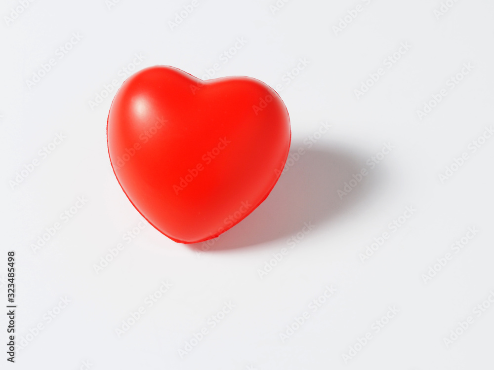 red heart on a white background. Concept of love, health day, Valentine's day red heart on a white background. Concept of love, health day, Valentine's day