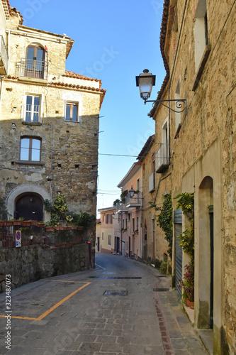 Pollica, Italy, 02/15/2020. A narrow street between the old houses of a medieval village in southern Italy