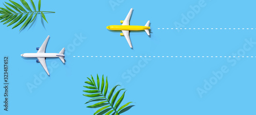 Flights booking and reservation theme with two miniature airplanes