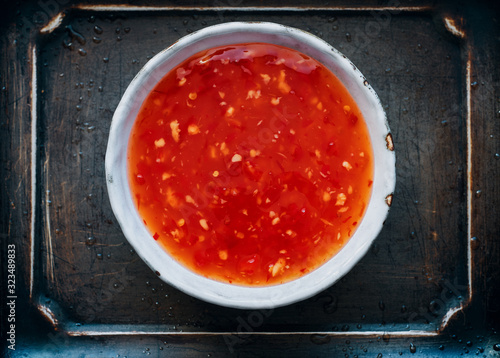 Chinese sweet and sour sauce with chili pepper and garlic in a bowl asian food
