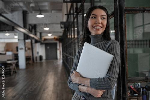 Asian woman smiling customer looking adult and confident, modern office place. Successful business strategy plan concept. Confident office worker indoor in coworking space. People lifestyle