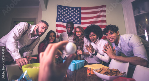 A group of young people celebrating and making party at home