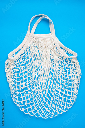 Zero waste mesh shopping bag, reusable washable bamboo shopping bag on blue background