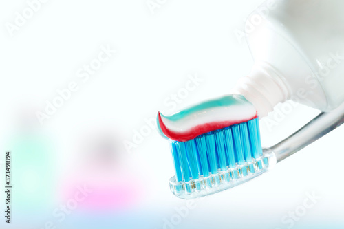 Toothbrush and toothpaste on blurred background. care for the oral cavity and teet