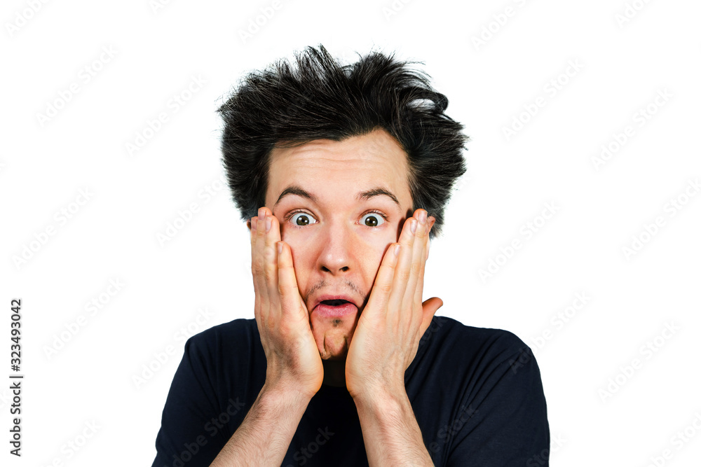 Shaggy young guy with long hair surprised with open mouth on a white isolated background Shaggy young guy with long hair surprised with open mouth on a white isolated background