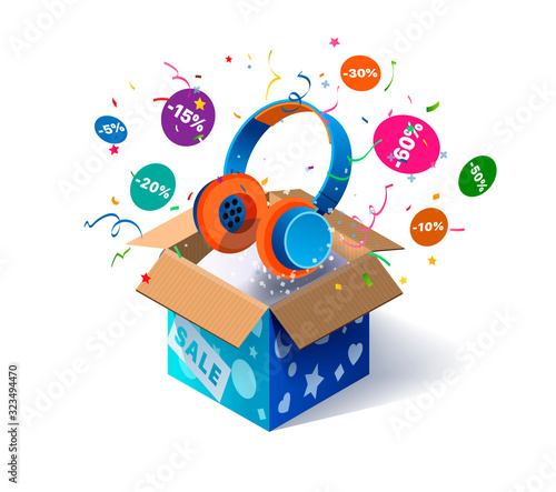 Open cardboard box with headphones and confetti explosion inside and on white background