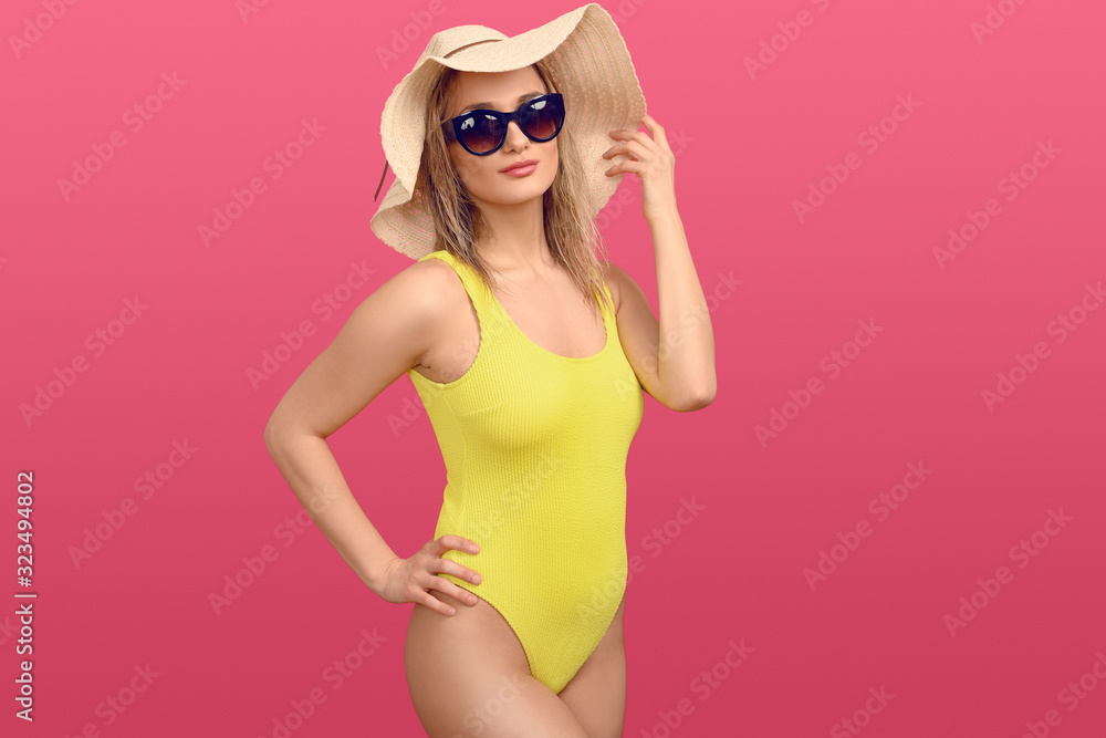 Trendy young woman in a yellow swimsuit Trendy young woman in a yellow swimsuit