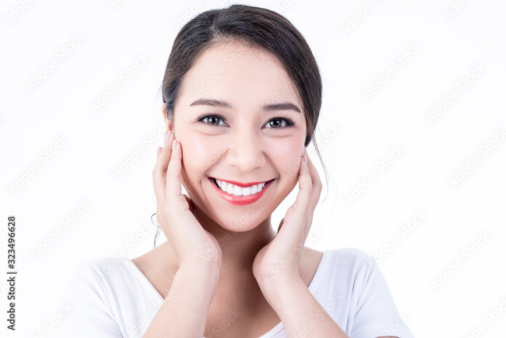 Portrait images of Asian young, pretty woman is 25 years old, She is smiling brightly, She has beautiful white and clean teeth, sparking eyes On white background to people and beauty concept. Portrait images of Asian young, pretty woman is 25 years old, She is smiling brightly, She has beautiful white and clean teeth, sparking eyes On white background to people and beauty concept.