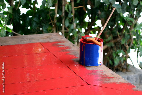 Painting work, painting the table with red paint