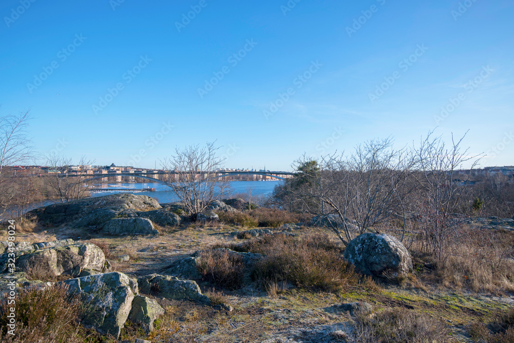 View from the hill on the island Långholmen over the bridge Västerbron and the districkt Kungsholmen in Stockholm a sunny winter day