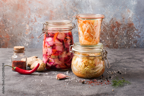 Bild auf Leinwand Fermented cabbage, fermented vegetables, kimchi in glas jars, marinated canned f