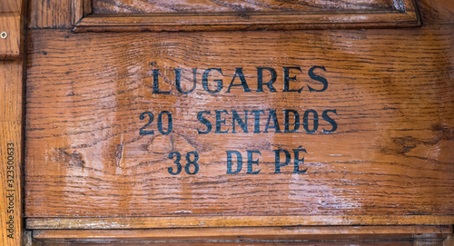 Wooden sign inside a Portuguese tram
