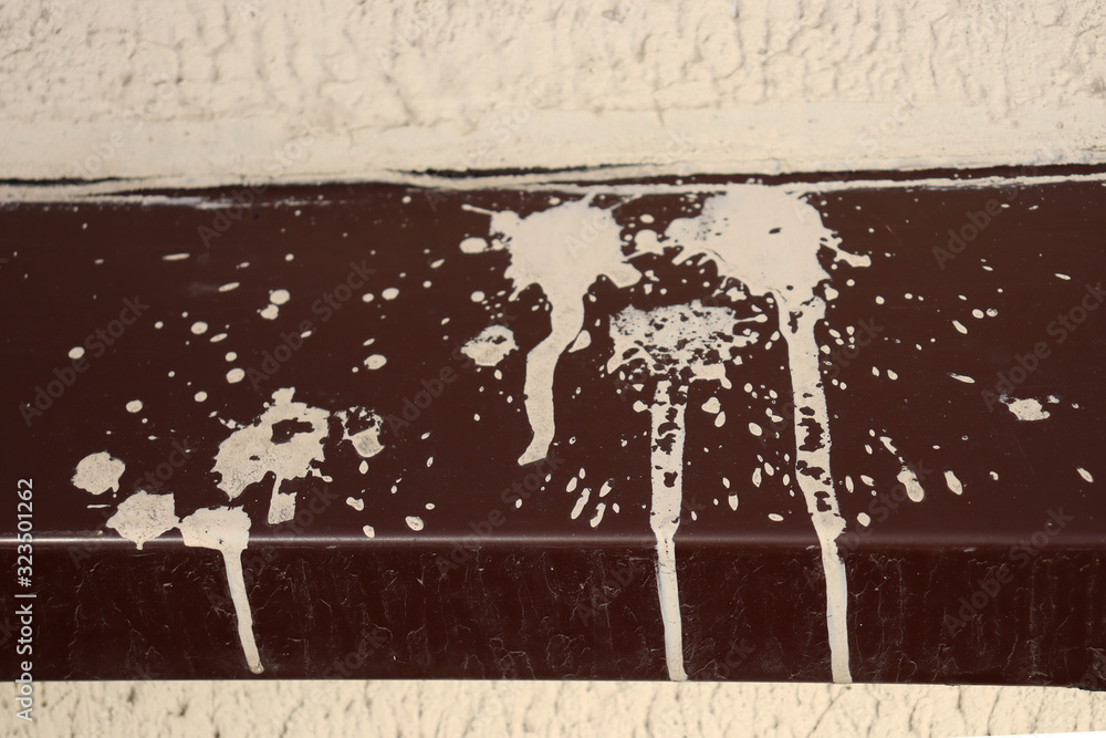 Fototapeta premium White spots from paint on a peak of a building.