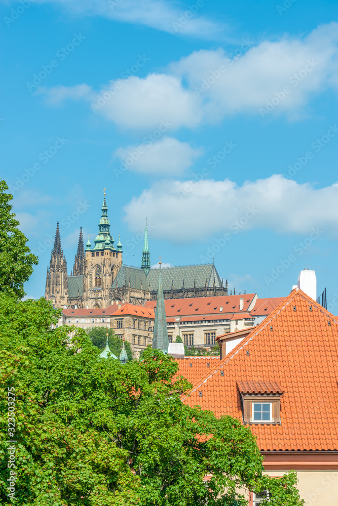 Top view to red roofs and blue sky skyline of Prague city Czech republic.