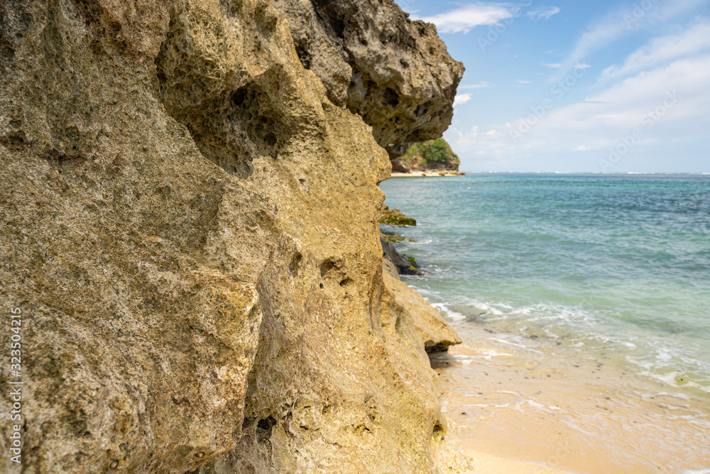 Fototapeta premium Cliff in beautiful deserted beach stock photo