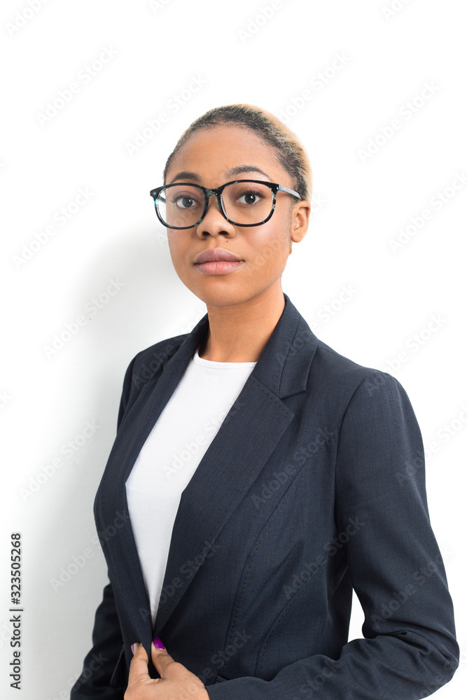 Portrait of a business African American successful woman in suit on white background. Portrait of a business African American successful woman in suit on white background.