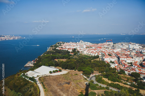 Fototapeta Naklejka Na Ścianę i Meble -  Panoramic view of Almada city and municipality, seen from the Sanctuary of Christ the King, Lisbon, Greater Lisbon, Portugal, summer sunny view