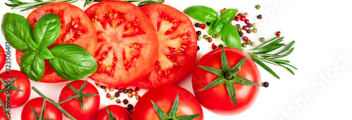 Creative layout made of Tomato, herbs and spices. Red tomatoes and basil leaves isolated on white background. Flat lay. Top view