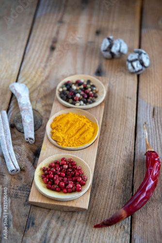 Fototapeta Naklejka Na Ścianę i Meble -  Aromatic herbal spices and red pepper for flavouring and seasoning